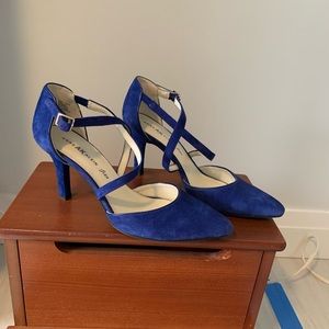 Royal blue suede cross strap pumps.